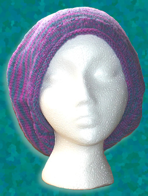 Hand knit slouch hats made of the finest sock yarns in Taos, New Mexico. This custom designed, hand knit slouch hat is made from fine sock yarns in wool and cotton blends for year-round wear, a perfect and comfortable fit, softness against the skin, beautiful draping qualities and years of wear.